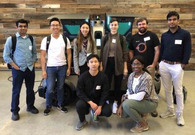 grad students on the Silicon Valley Trek pose on site at a company