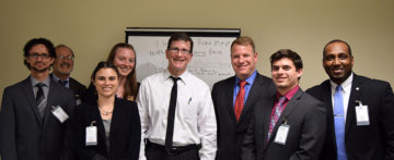 participants in the Day in Albany site visit pose with professionals at the NYS DEC