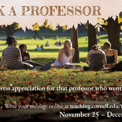 Group of students sitting on green grass among trees