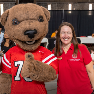 Sarah Day with Touchdown the bear, Cornell's mascot
