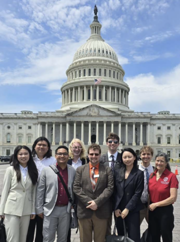 a group gathered in front of the US Capitol